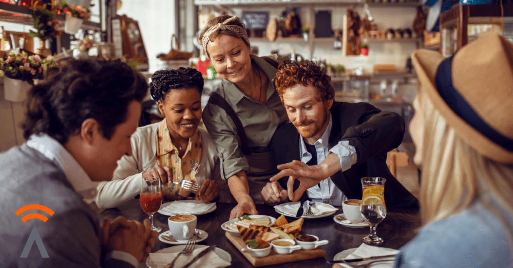 Small business owner serving customers food and drinks